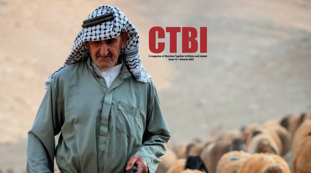 CTBI Magazine Autumn 2025: Shepherd Abu Okab tends to his sheep in the Jordan Valley on the West Bank. Ecumenical Accompaniers from the World Council of Churches Ecumenical Accompaniment Programme accompany shepherds, a presence known to have a mitigating effect on confrontations between Israeli settlers and Palestinians. EAs’ presence also helps Palestinians access lands they otherwise might not have dared to continue to cultivate. In the West Bank’s Area C, any land that isn’t cultivated for a period of three years becomes property of the state, the shepherds explain, so accessing their lands regularly is vital for the communities and their herds. © Albin Hillert/WCC